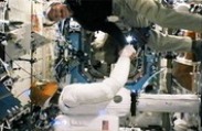 Greetings, Human! Space Robot Shakes Astronaut's Hand, Signs 'Hello'
