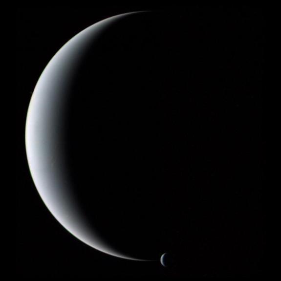 Crescent Neptune and Triton taken by Voyager 2