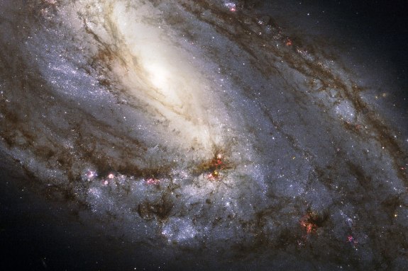 Unusual Spiral Galaxy M66 by Hubble 